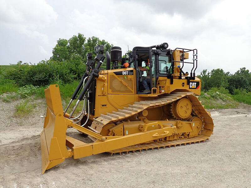 Picture of a medium sized bulldozer used by Champ Landfill in their daily operation.