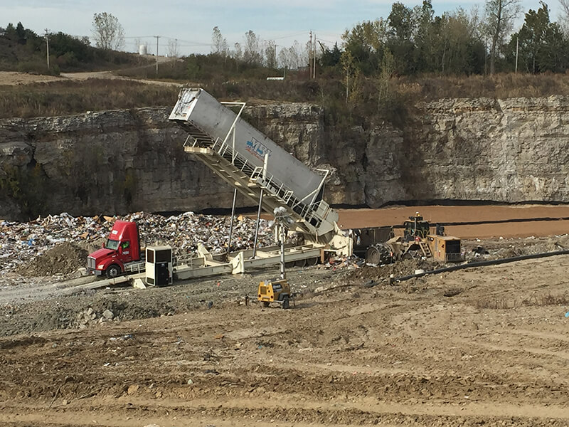 Picture of a Champ Landfill Tipper emptying waste into the landfill.